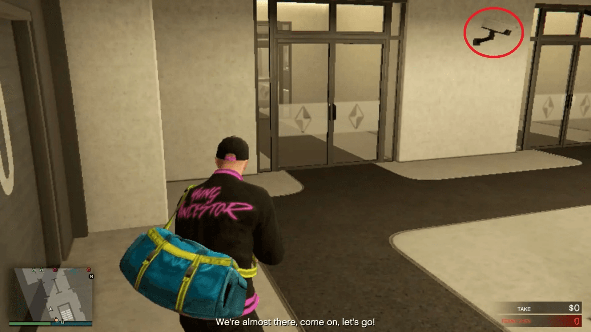 The security camera right beside the double doors leading to the security lobby area