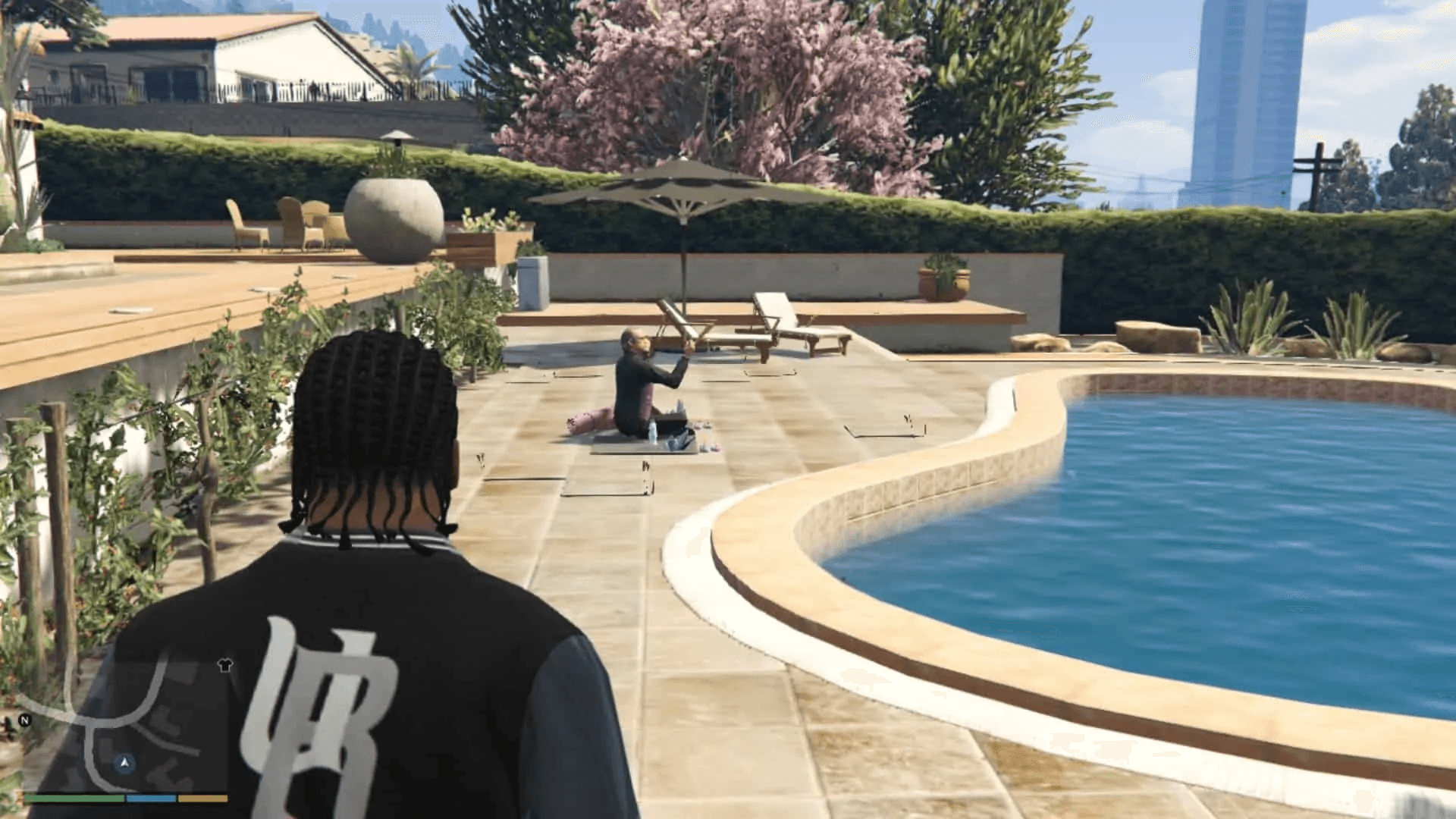 Peter performing yoga in the backyard of his house by the swimming pool