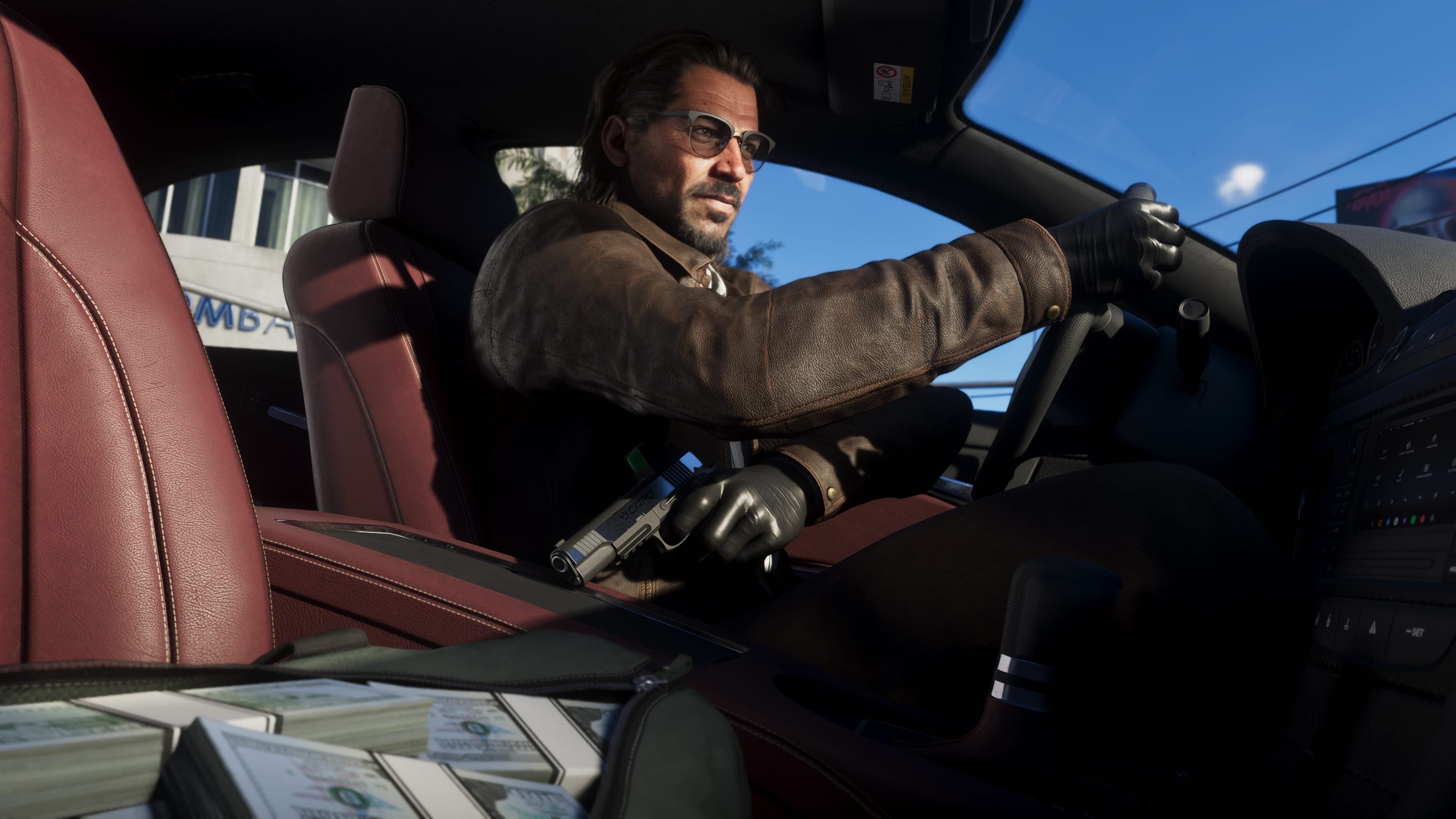 Raul Bautista driving away on an unidentified vehicle with a bag full of money in the passenger's seat.